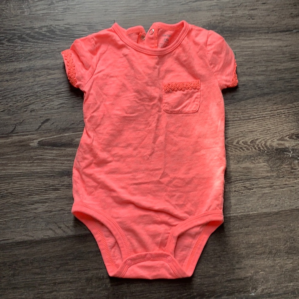 Bright Pink Onesie with flower lace accent.